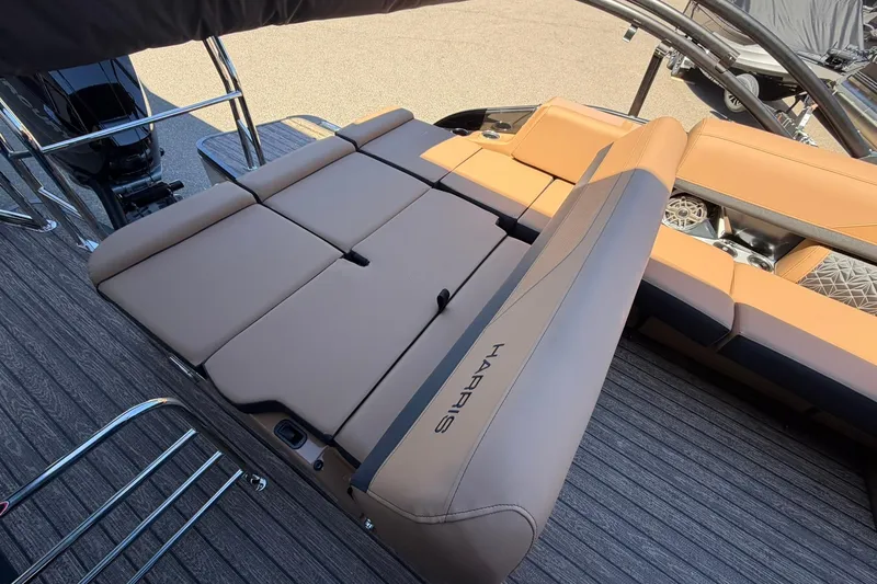 Slide: The Image of 2026 Harris Grand Mariner 250 SL boat with luxurious tan seating and sleek design. - 19