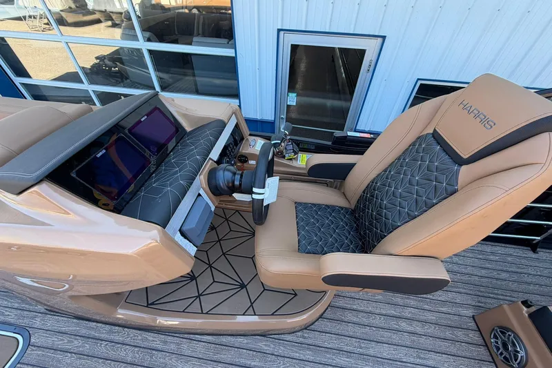 Slide: The Image of Luxurious helm of 2026 Harris Grand Mariner 250 SL with plush seating and modern controls. - 26