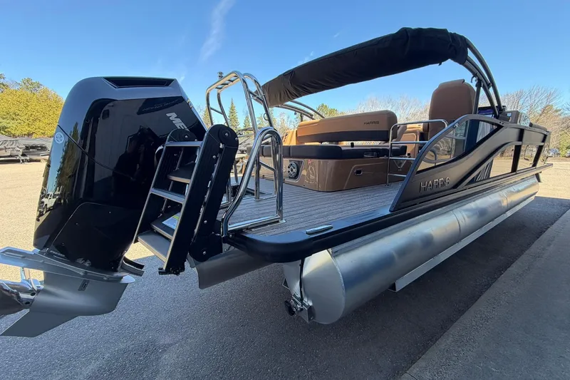 Slide: The Image of 2026 Harris Grand Mariner 250 SL pontoon boat with sleek design and powerful engine. - 4