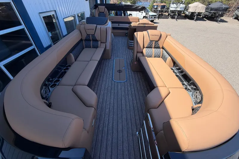 Slide: The Image of Luxurious interior of 2026 Harris Grand Mariner 250 SL pontoon boat with tan seating. - 8
