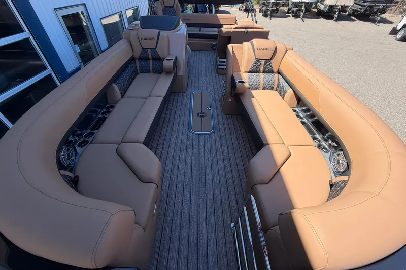 Slide: The Image of Luxurious interior of 2026 Harris Grand Mariner 250 SL pontoon boat with tan seating. - 9
