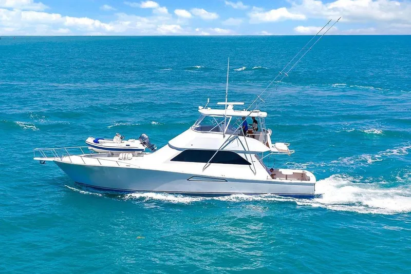 The Image of A Viking 55 Convertible yacht cruising on clear blue ocean waters. - 0