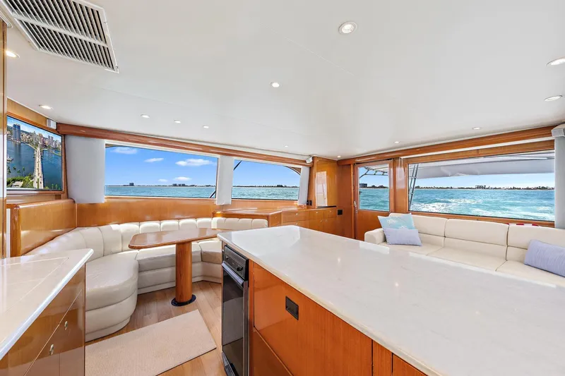 Slide: The Image of Luxurious interior of Viking 55 Convertible yacht with ocean view, featuring elegant seating and modern design. - 4