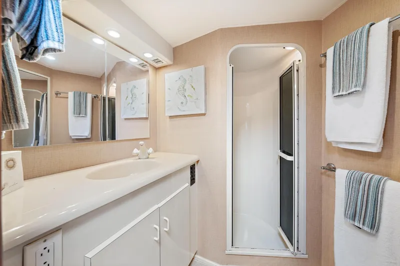 Slide: The Image of Bathroom interior of 1998 Viking 55 Convertible yacht with shower and vanity. - 9