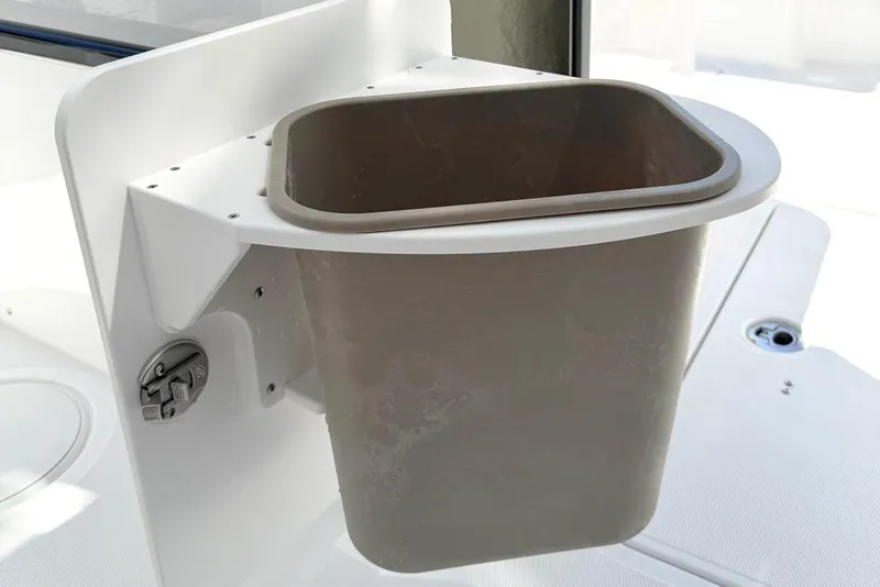 Slide: The Image of Trash bin on 2026 Sea Hunt Ultra 285 Coffin Box boat, mounted on white panel. - 12