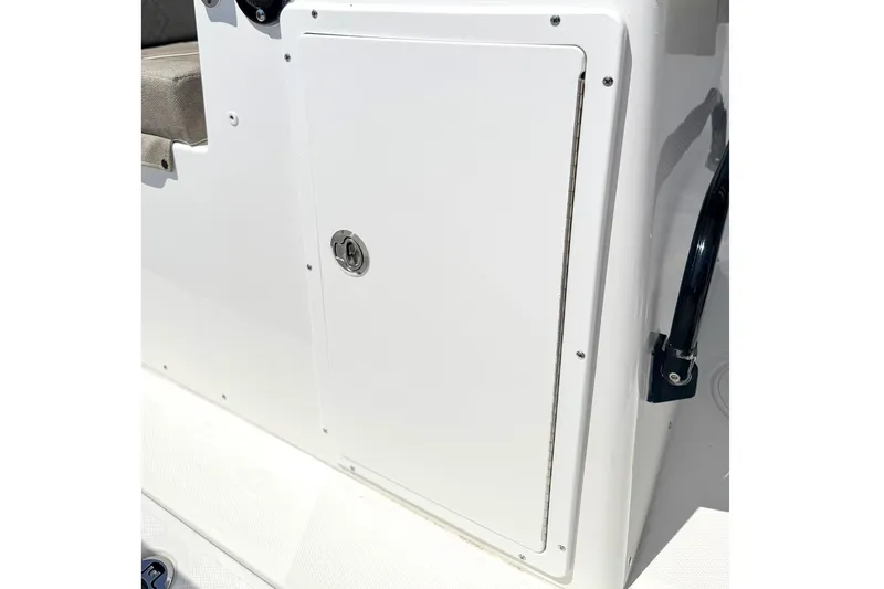 Slide: The Image of 2026 Sea Hunt Ultra 285 Coffin Box storage compartment with secure latch. - 13