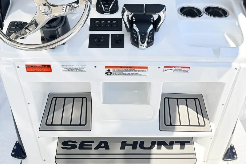 Slide: The Image of 2026 Sea Hunt Ultra 285 Coffin Box helm with controls and branding. - 15