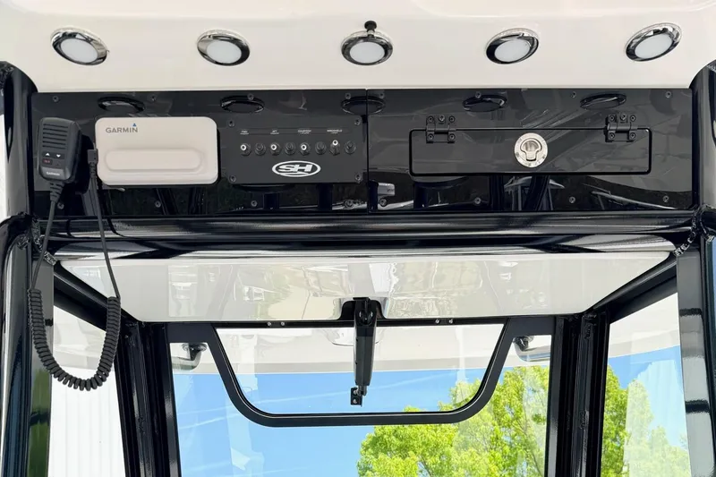 Slide: The Image of Control panel of 2026 Sea Hunt Ultra 285 Coffin Box boat with Garmin device. - 17