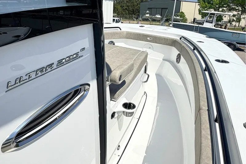 Slide: The Image of 2026 Sea Hunt Ultra 285 Coffin Box boat interior with seating and sleek design. - 18