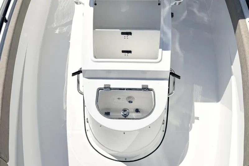Slide: The Image of 2026 Sea Hunt Ultra 285 Coffin Box boat interior with storage compartment and seating. - 21
