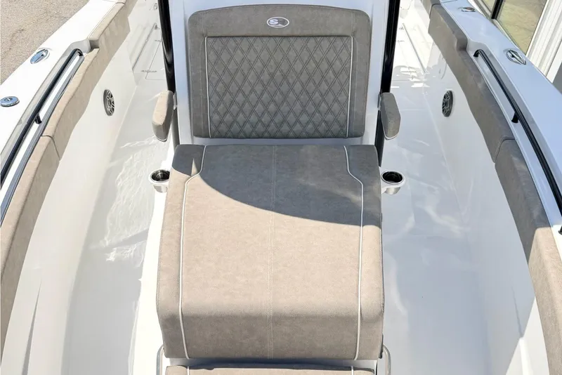 Slide: The Image of 2026 Sea Hunt Ultra 285 Coffin Box boat interior with cushioned seating. - 22