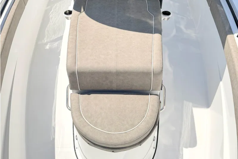 Slide: The Image of 2026 Sea Hunt Ultra 285 Coffin Box boat interior with cushioned seating. - 23