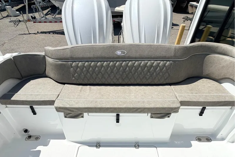 Slide: The Image of 2026 Sea Hunt Ultra 285 Coffin Box boat seating with diamond-patterned upholstery. - 4