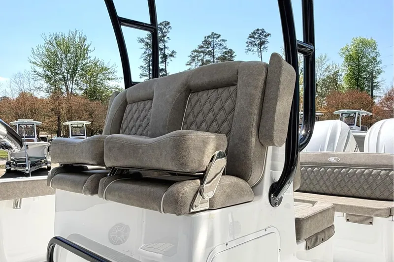 Slide: The Image of 2026 Sea Hunt Ultra 285 Coffin Box boat with plush seating and sleek design. - 9