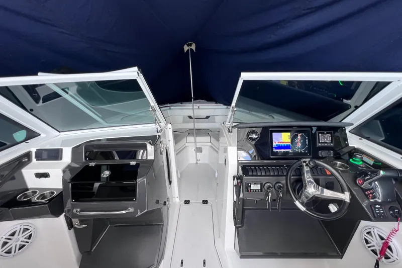 Slide: The Image of 2023 Blackfin 272 DC boat interior with modern dashboard and steering wheel. - 101