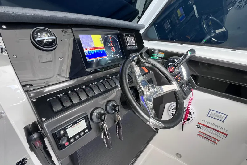 Slide: The Image of 2023 Blackfin 272 DC boat dashboard with advanced navigation and control systems. - 102