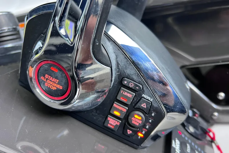 Slide: The Image of Close-up of 2023 Blackfin 272 DC boat engine control panel with start/stop button. - 105