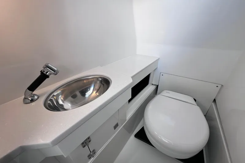 Slide: The Image of Modern bathroom in 2023 Blackfin 272 DC boat with sleek sink and toilet. - 116