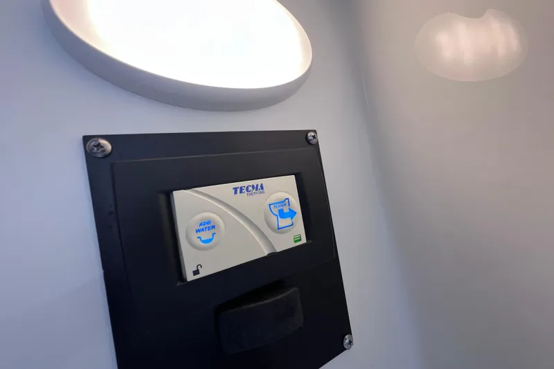 Slide: The Image of Control panel for Tecma toilet system on 2023 Blackfin 272 DC boat. - 117