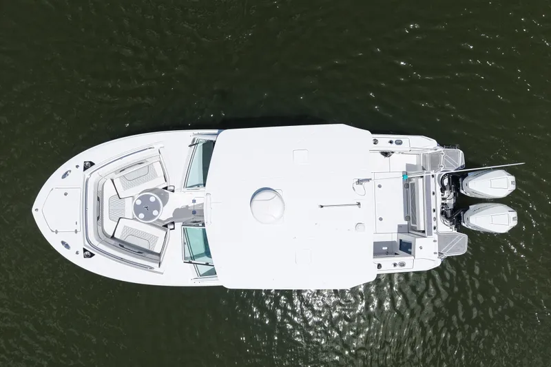 Slide: The Image of Aerial view of 2023 Blackfin 272 DC boat on water. - 14