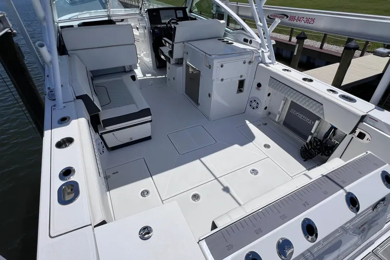 Slide: The Image of 2023 Blackfin 272 DC boat interior with seating and fishing amenities. - 25