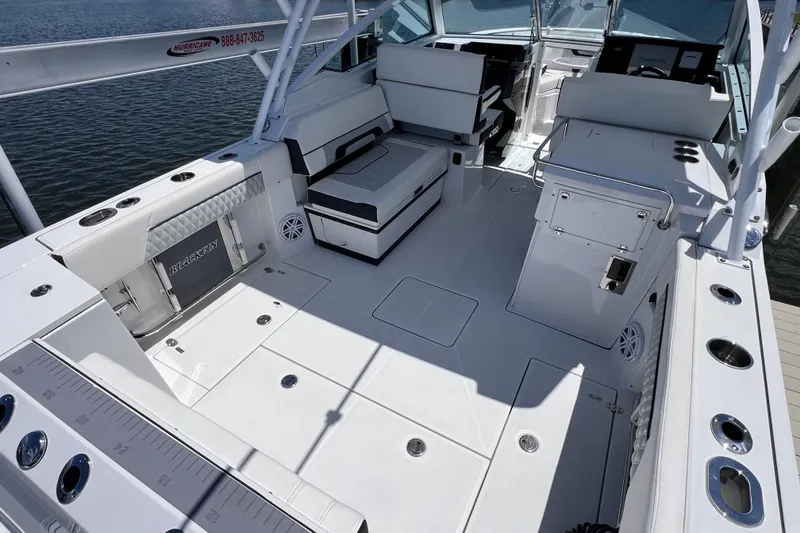 Slide: The Image of 2023 Blackfin 272 DC boat interior with seating and fishing rod holders. - 26