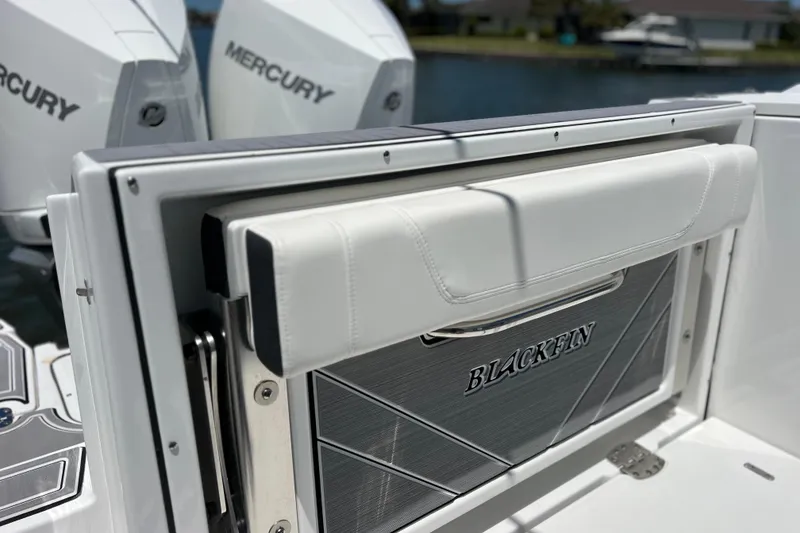 Slide: The Image of 2023 Blackfin 272 DC boat with Mercury engines, featuring sleek design details. - 30