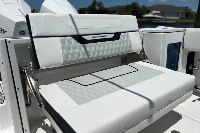 Slide: The Image of 2023 Blackfin 272 DC boat seat with white upholstery and diamond stitching. - 31