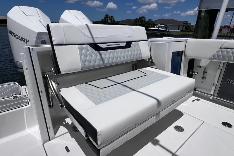 Slide: The Image of 2023 Blackfin 272 DC boat with luxurious seating and dual Mercury engines. - 32