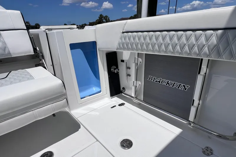 Slide: The Image of 2023 Blackfin 272 DC boat interior with seating and storage compartments. - 33