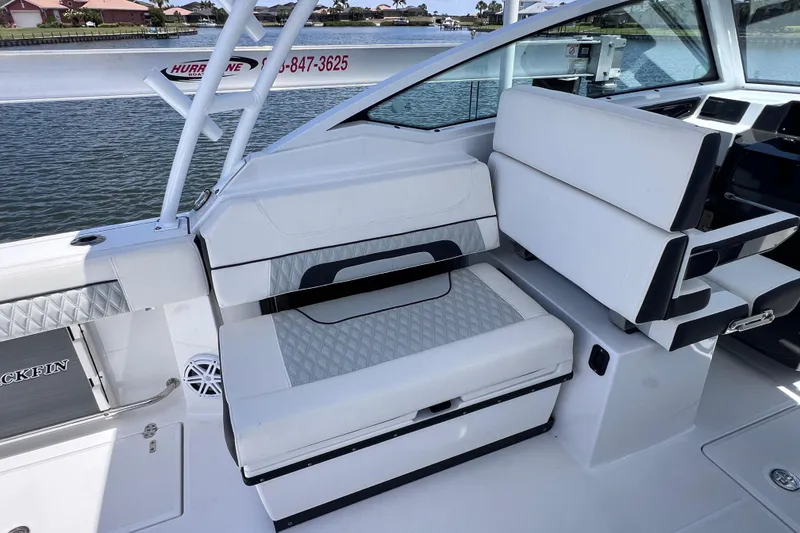 Slide: The Image of 2023 Blackfin 272 DC boat interior with white seating and sleek design. - 42