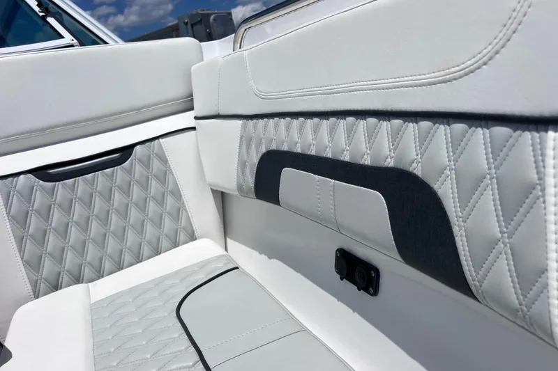 Slide: The Image of Luxurious interior seating of 2023 Blackfin 272 DC boat with diamond stitching. - 57