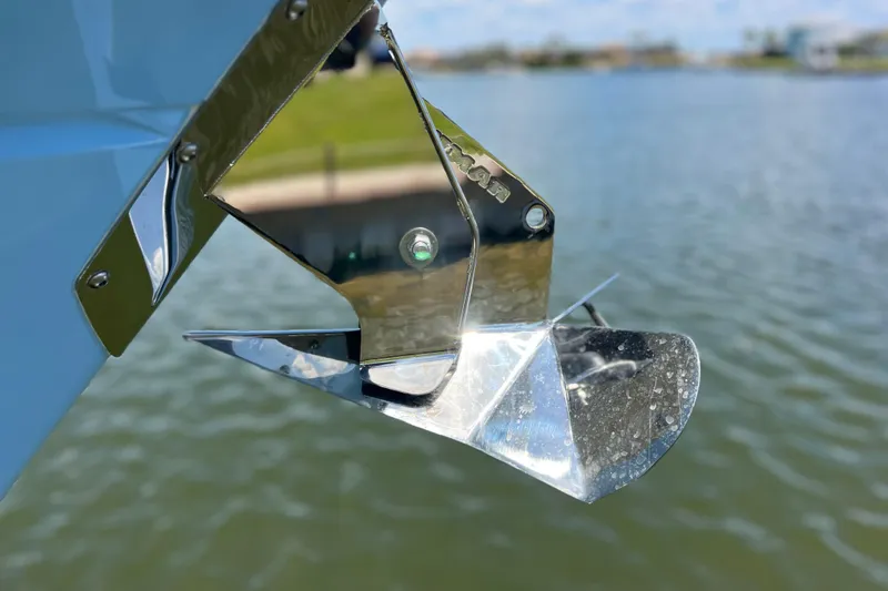 Slide: The Image of Shiny anchor detail on 2023 Blackfin 272 DC boat by the water. - 63