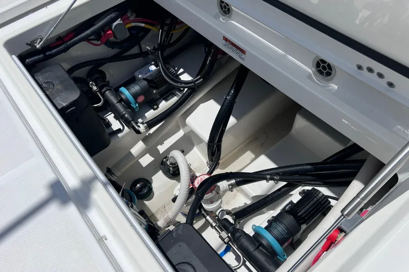 Slide: The Image of Engine compartment of 2023 Blackfin 272 DC boat, showcasing wiring and components. - 73