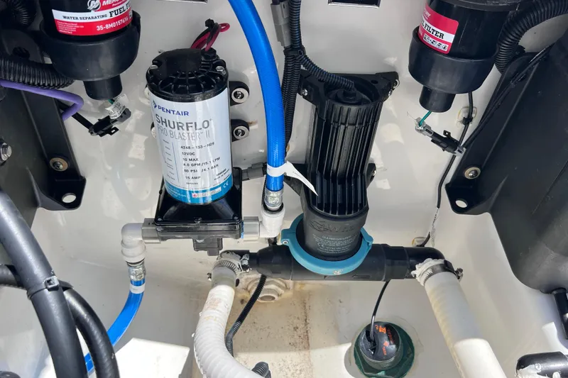 Slide: The Image of 2023 Blackfin 272 DC boat engine compartment with Shurflo Pro Blaster pump and filters. - 74