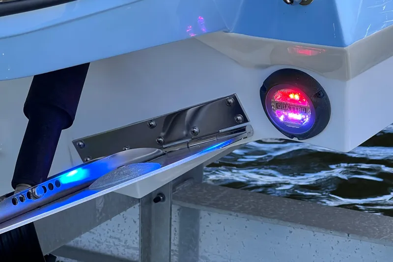 Slide: The Image of 2023 Blackfin 272 DC boat with illuminated underwater LED lights. - 76