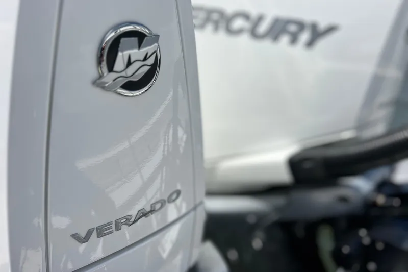Slide: The Image of Close-up of a 2023 Blackfin 272 DC boat with Mercury Verado engine logo. - 79