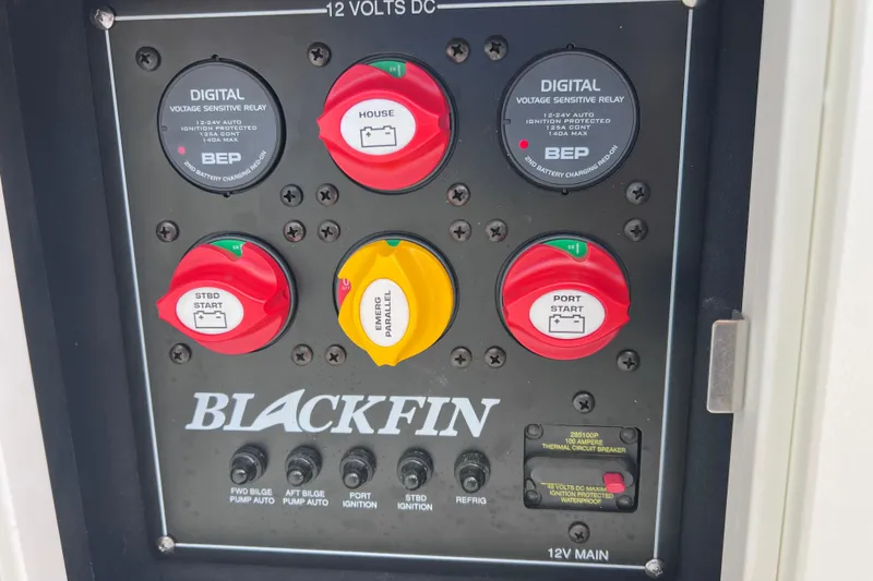 Slide: The Image of Control panel of 2023 Blackfin 272 DC boat with switches and voltage relays. - 88