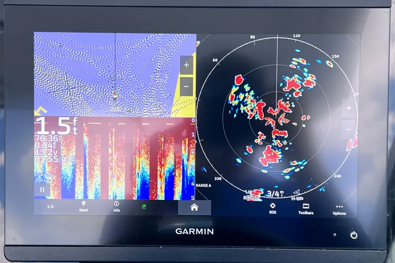 Slide: The Image of Garmin marine display on 2023 Blackfin 272 DC, showing sonar and radar data. - 93