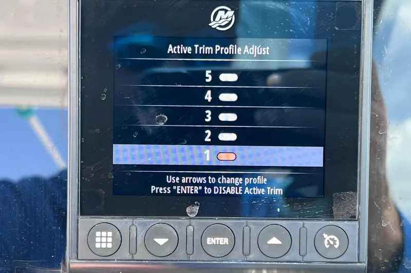 Slide: The Image of Display screen showing active trim profile adjustment on a 2023 Blackfin 272 DC boat. - 95
