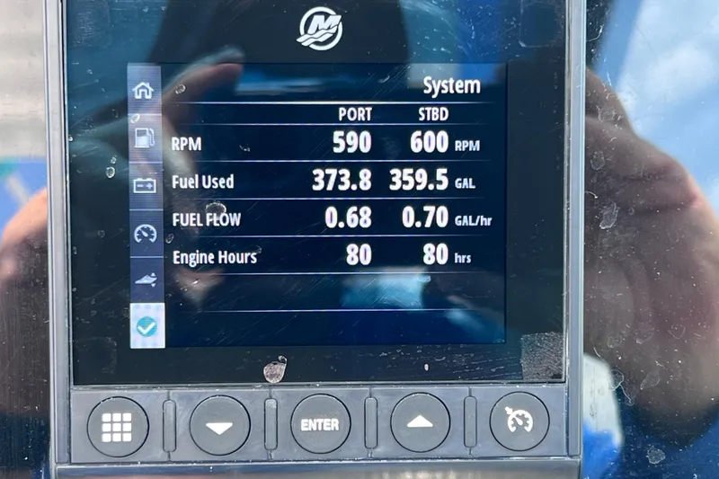 Slide: The Image of Display screen showing 2023 Blackfin 272 DC engine stats: RPM, fuel used, flow, and hours. - 97