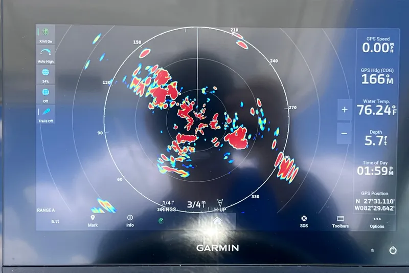 Slide: The Image of Garmin marine radar display on 2023 Blackfin 272 DC, showing GPS data and water temperature. - 98