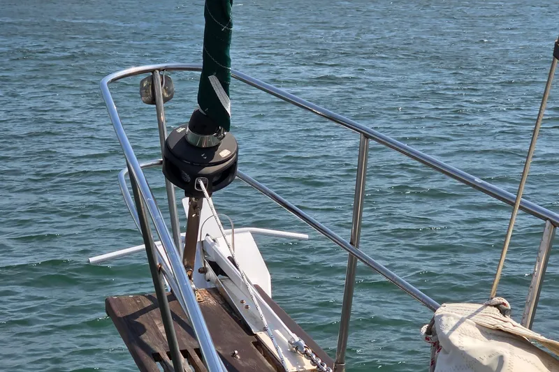 Slide: The Image of Bow of 1987 Gozzard 36 Cruiser sailboat on calm water. - 11