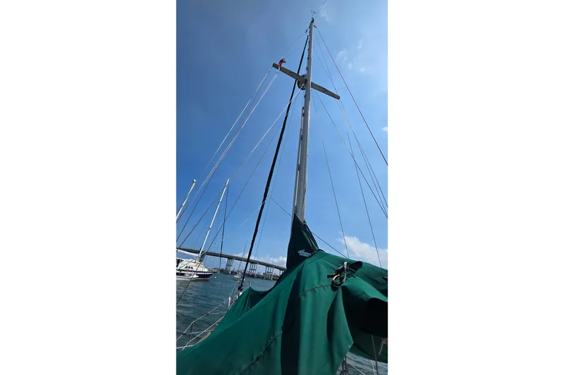 Slide: The Image of Sailboat mast of 1987 Gozzard 36 Cruiser against clear blue sky. - 14