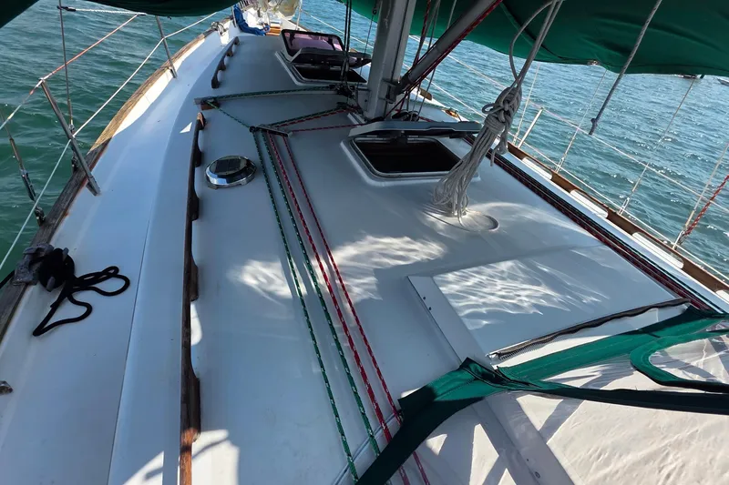 Slide: The Image of 1987 Gozzard 36 Cruiser sailboat deck with green canopy and ropes. - 15