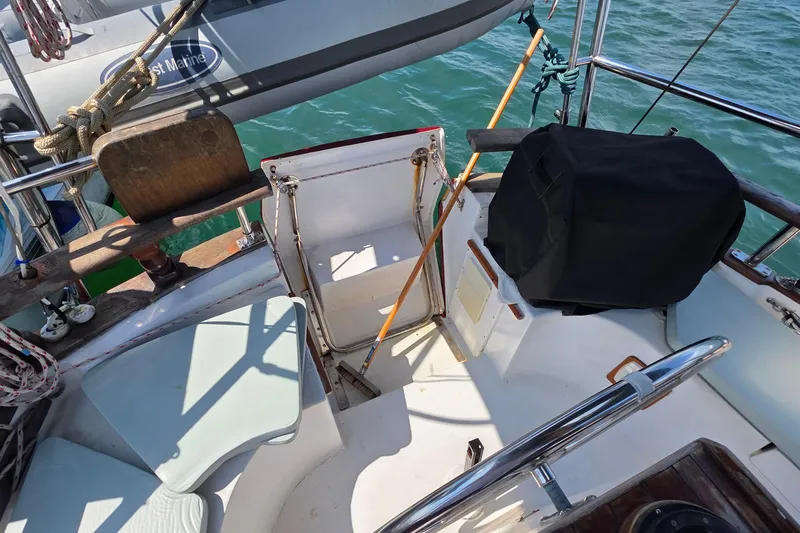 Slide: The Image of Cockpit of 1987 Gozzard 36 Cruiser sailboat with seating and equipment. - 18