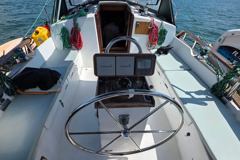 Slide: The Image of Cockpit of 1987 Gozzard 36 Cruiser with Garmin navigation system and steering wheel. - 21