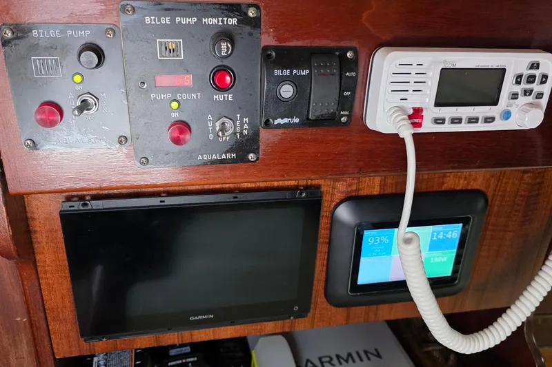 Slide: The Image of Control panel of a 1987 Gozzard 36 Cruiser with bilge pump monitor and marine radio. - 27