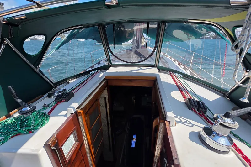 Slide: The Image of Interior view of 1987 Gozzard 36 Cruiser sailboat cockpit with ropes and winches. - 28
