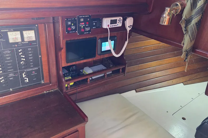 Slide: The Image of Interior of 1987 Gozzard 36 Cruiser with navigation and control panels. - 30